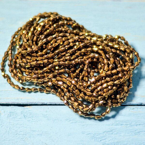 бусина "капля", граненая, стекло, цвет бронзовый металлик, 5х3мм